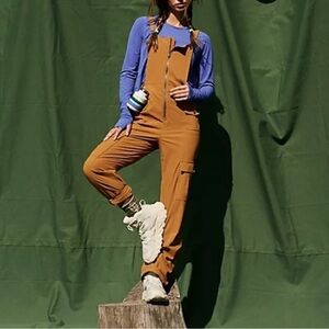 Free People Women’s Cascade Onesie in the Size Large in Amber Mustard Color